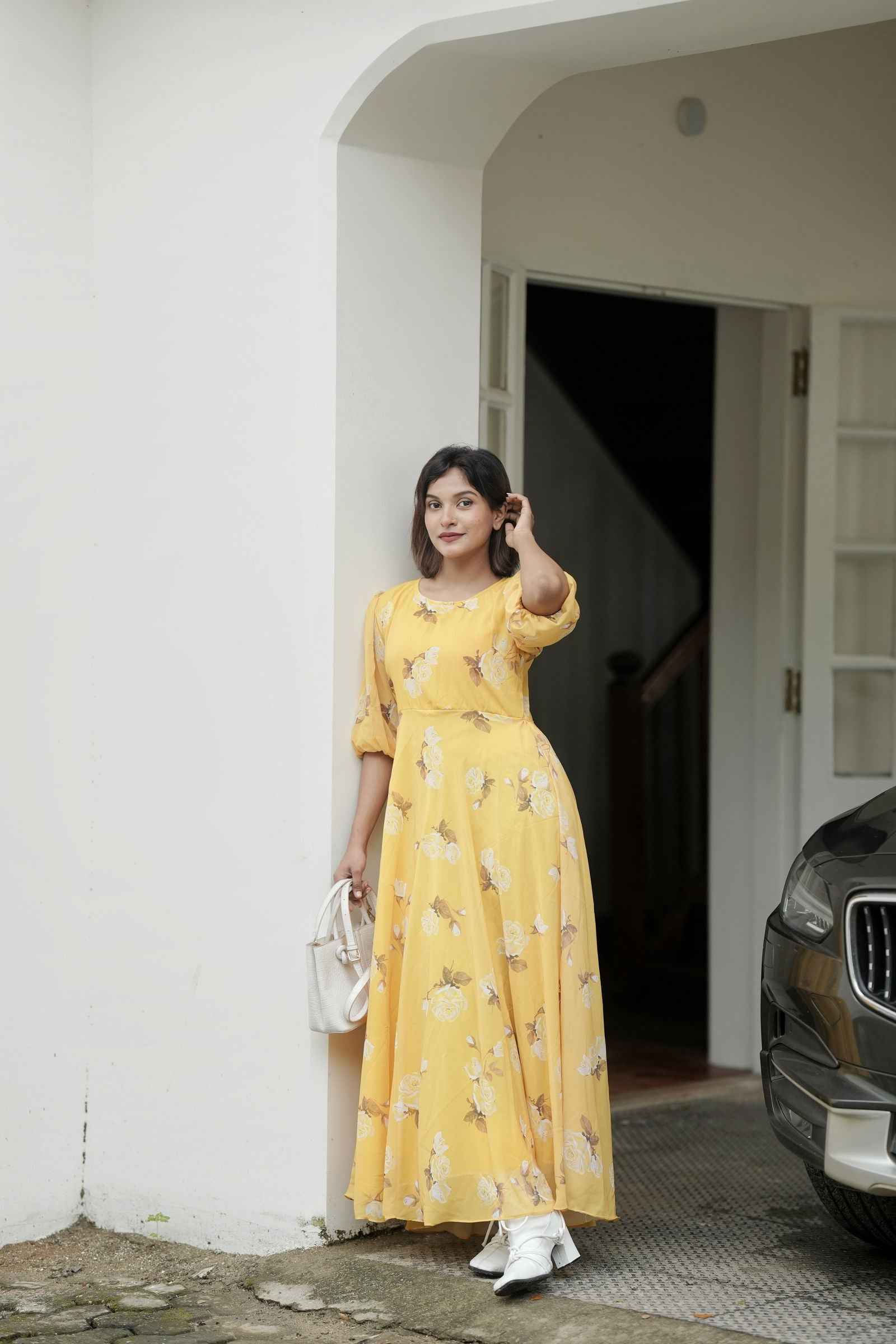 Yezwe yellow puff sleeve maxi dress featuring floral patterns, perfect for summer outings