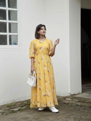 Yezwe yellow puff sleeve maxi dress with floral design, perfect for casual summer outings