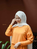 Modest orange co-ord set featuring a comfortable top and skirt for stylish everyday wear