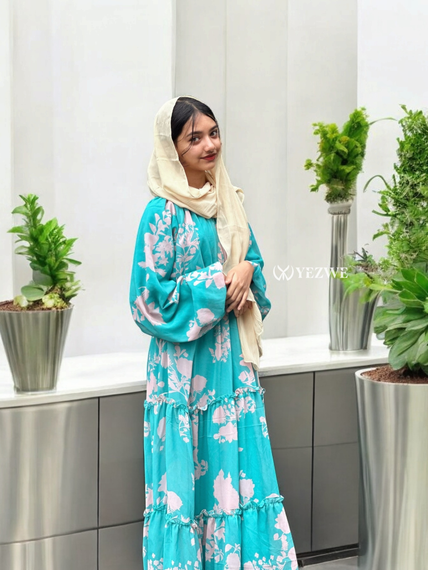 Aqua Blue Floral Maxi Dress by Yezwe featuring long sleeves and tiered design in a vibrant floral pattern
