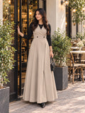 YEZWE Beige Layered Pinafore Maxi Dress with Black Inner Top stylishly worn outdoors