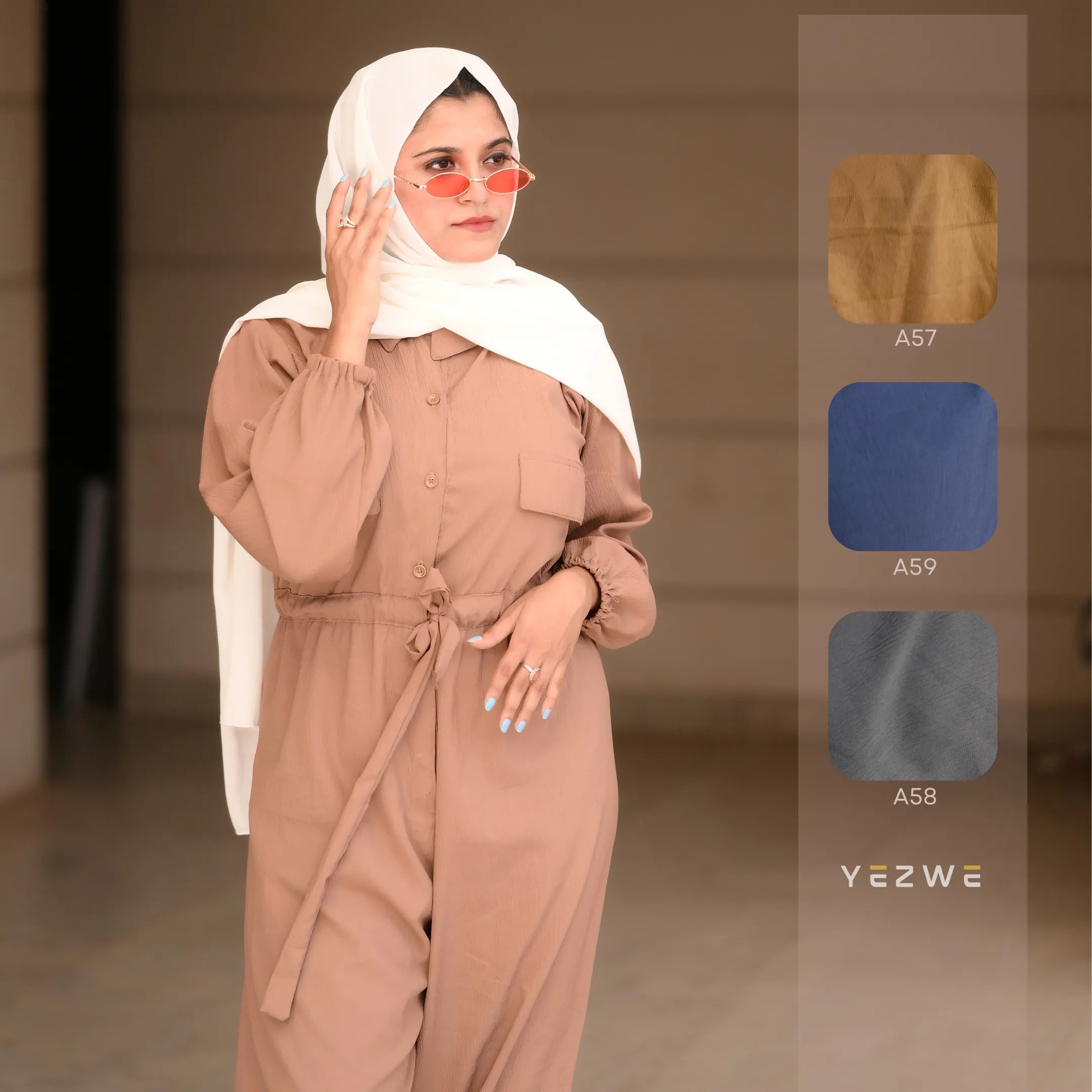 Yezwe belted front open jumpsuit in brown featuring a stylish button-up design and long sleeves