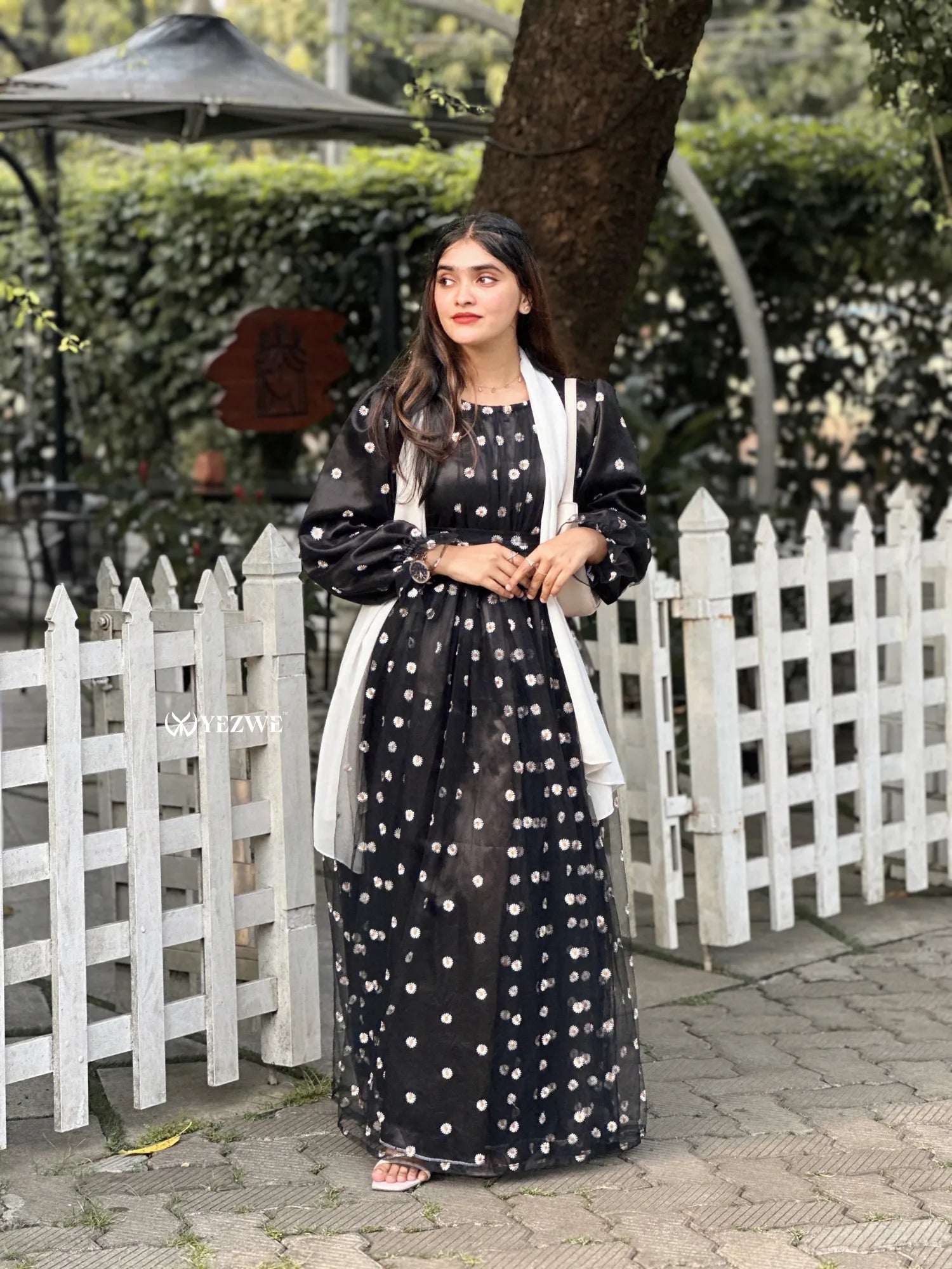 Yezwe black floral embroidery gown featuring puff sleeves and a flowy silhouette