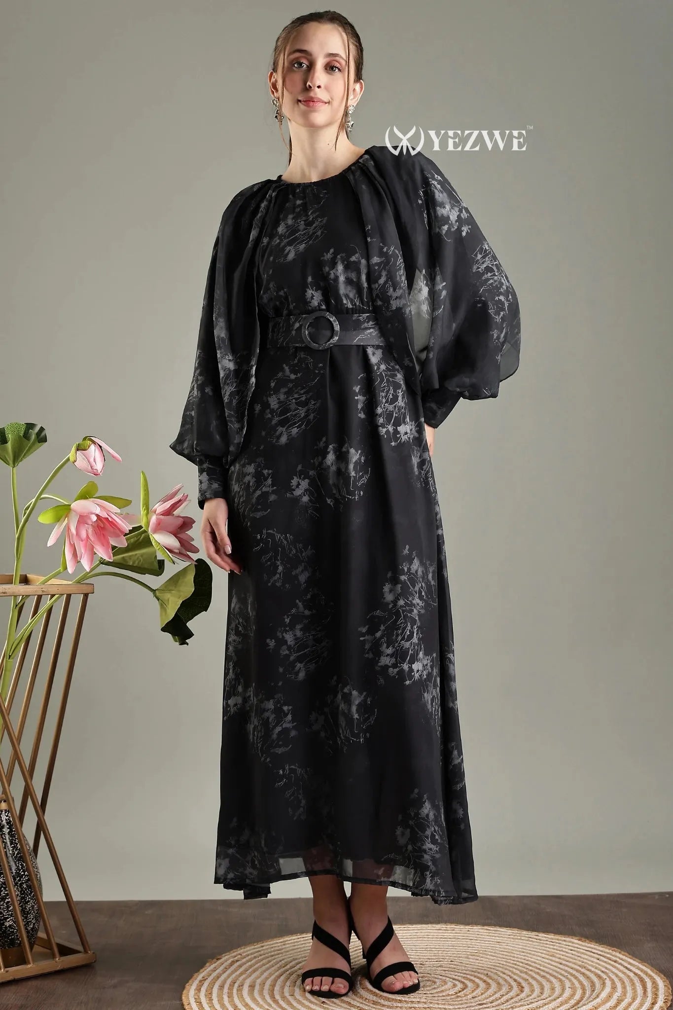 Elegant black floral print belted modest maxi dress by YEZWE with long sleeves and flowing skirt