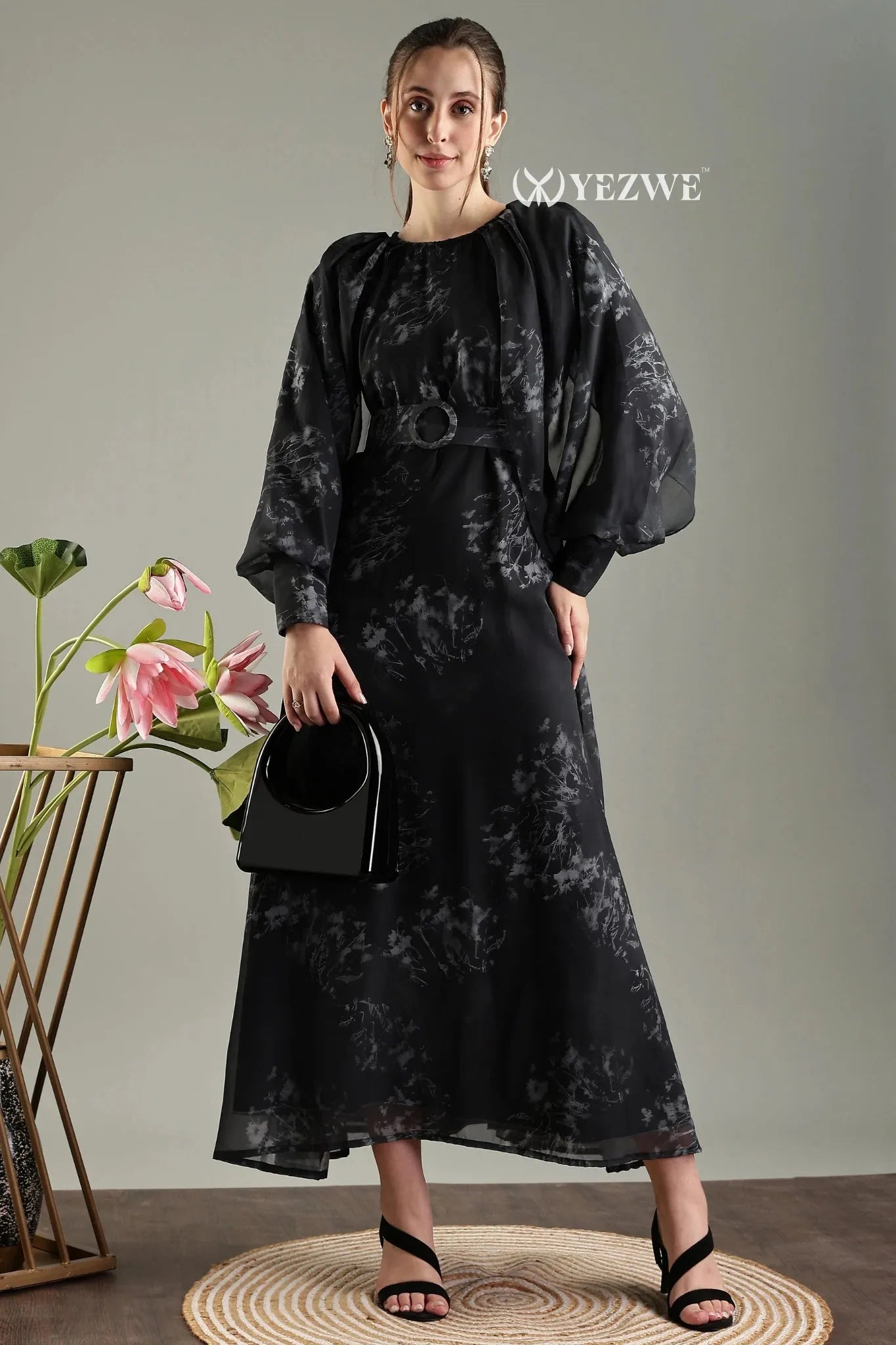 Elegant black floral print belted modest maxi dress by YEZWE, featuring puff sleeves and a stylish belt