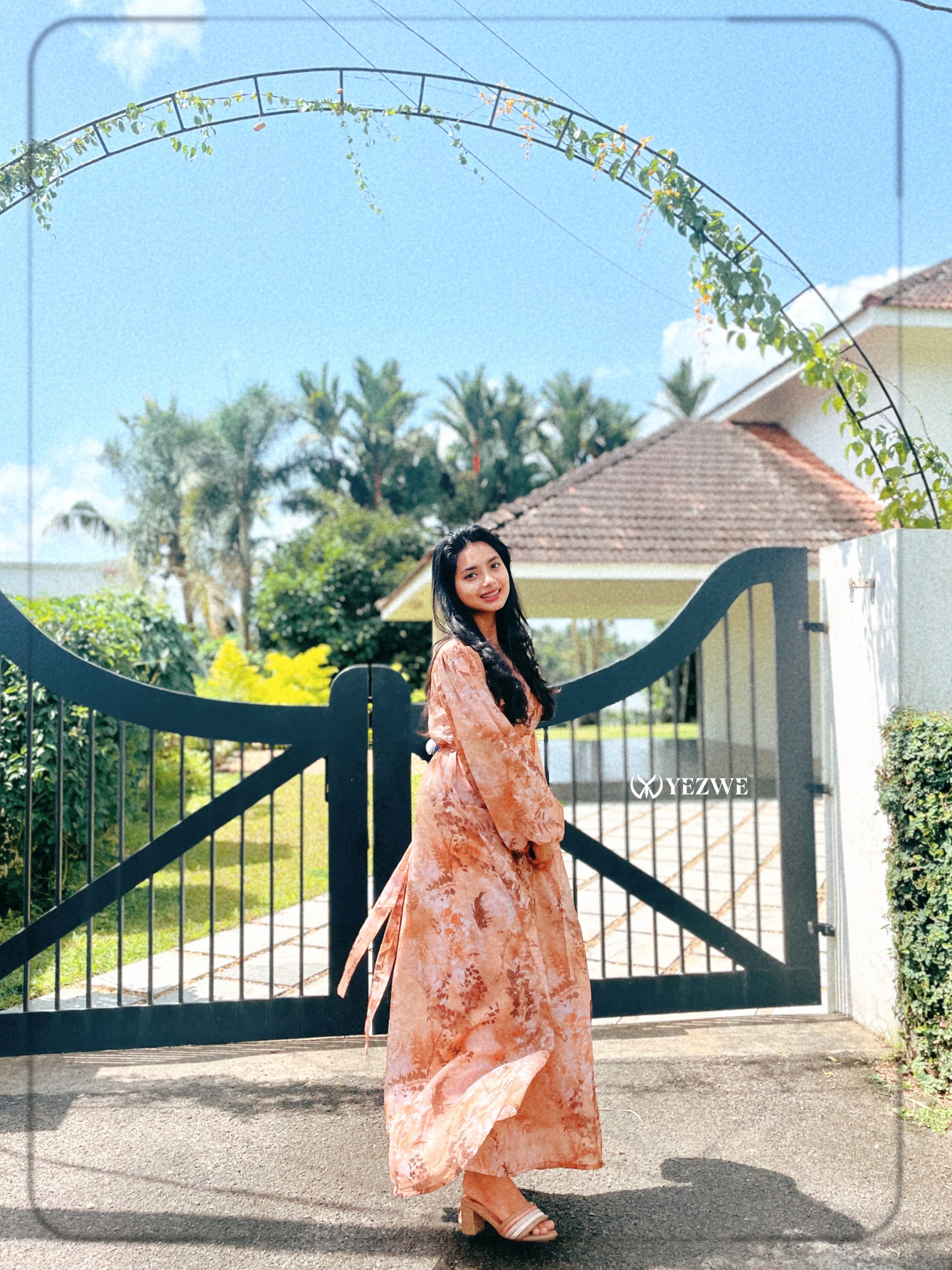 Yezwe brown floral georgette maxi dress displayed outdoors with a stylish silhouette