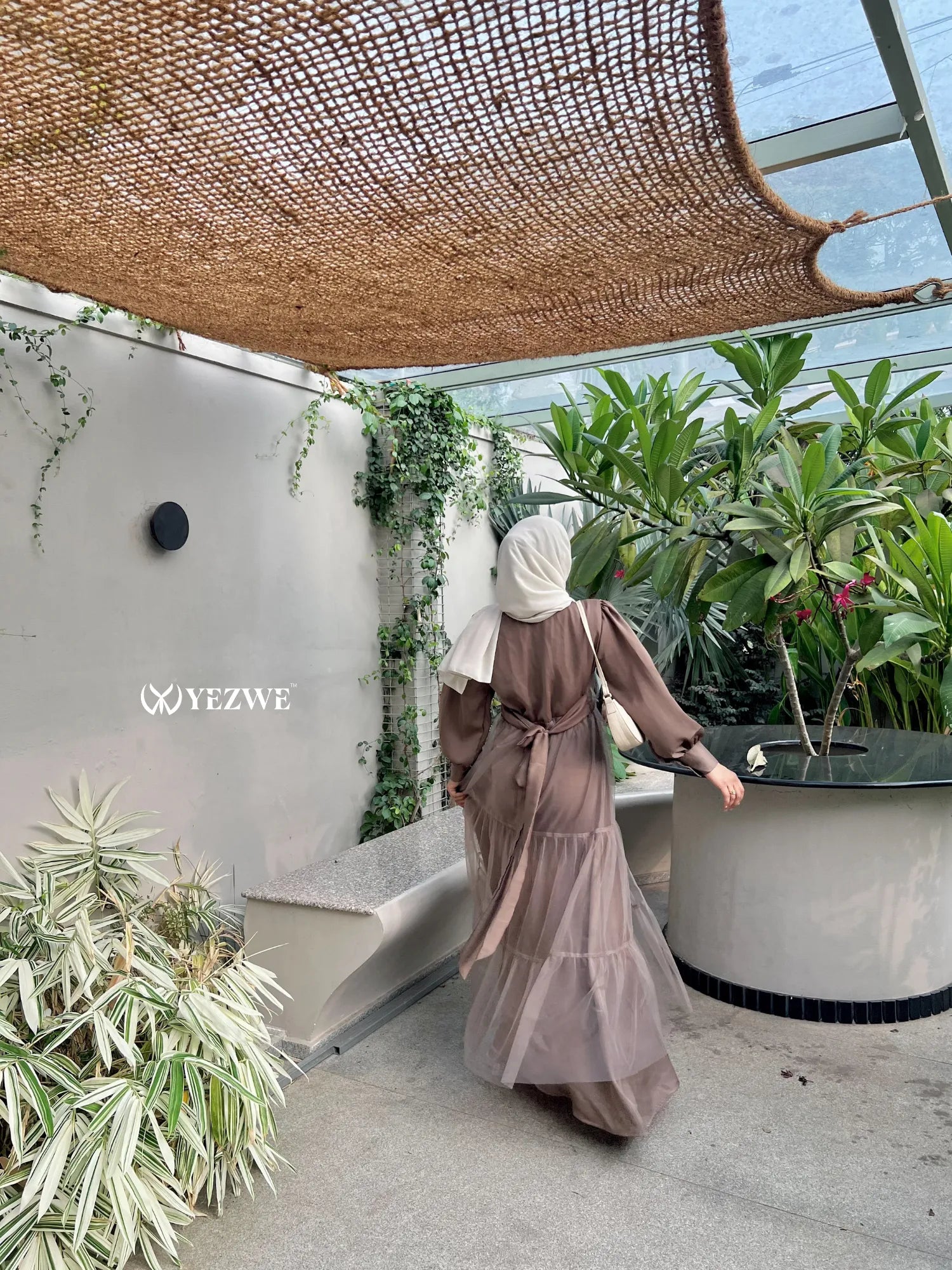 YEZWE brown skirt and top modest party wear co-ord set modeled outdoors with hijab