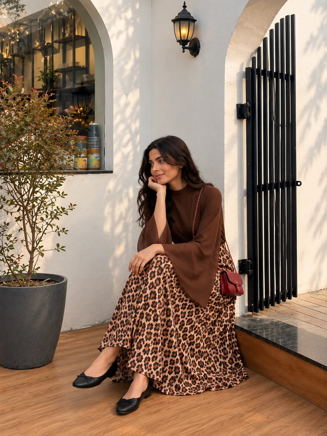 YEZWE Chocolate Brown Georgette Bell Sleeve Top & Classic Leopard Print Skirt in Outdoor Setting