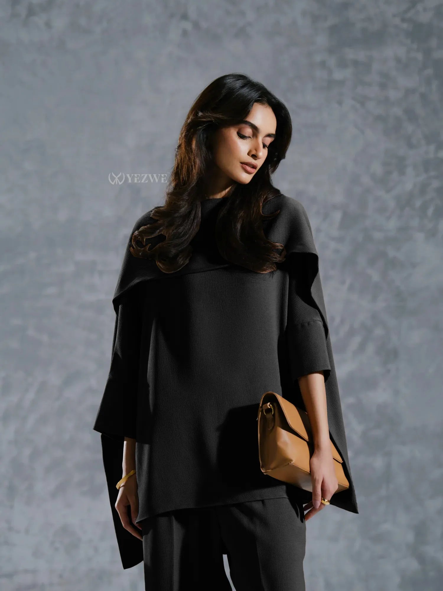 Stylish black Co-Ord Set by YEZWE featuring a loose top and matching pants with a modern silhouette