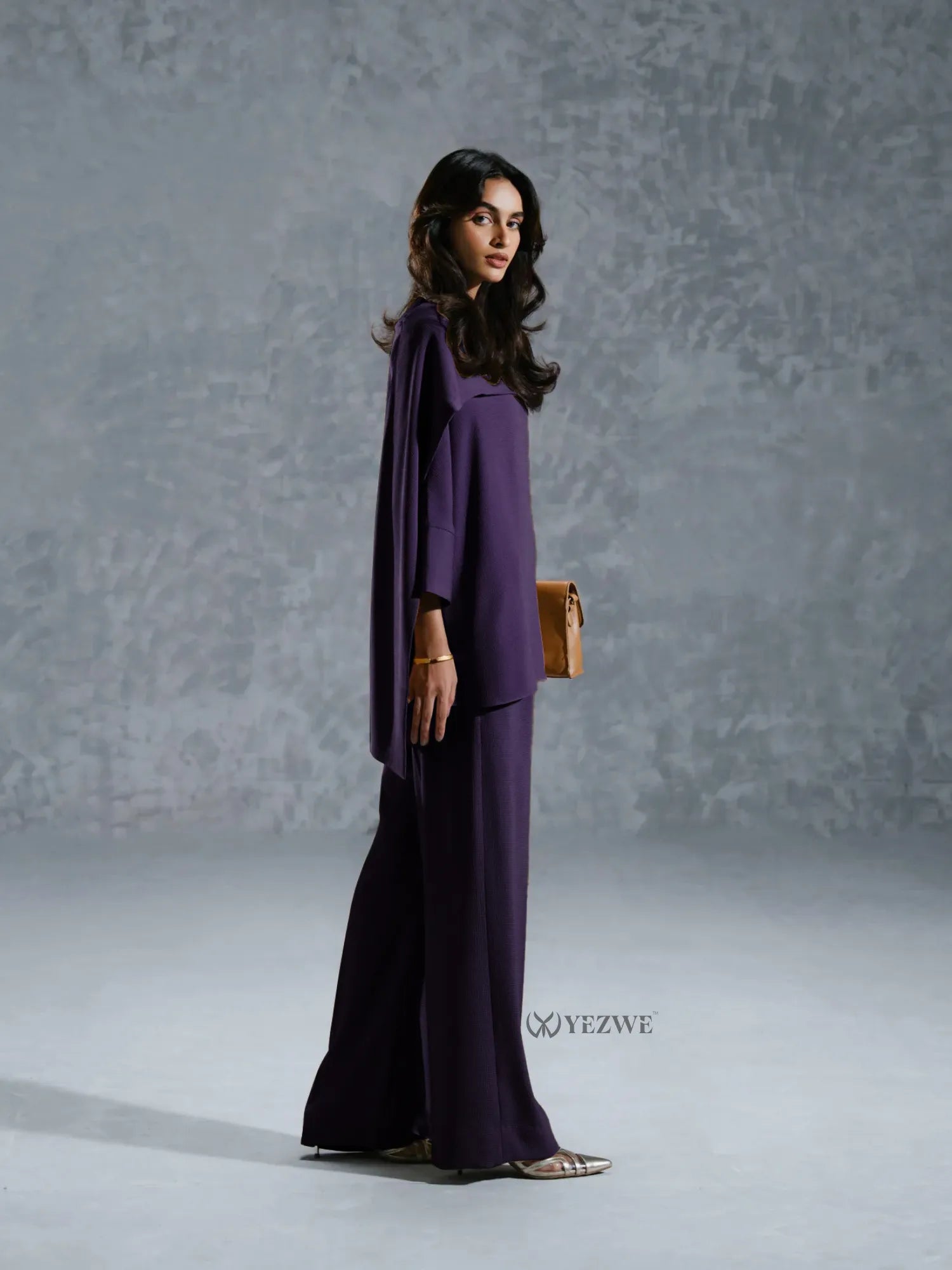 YEZWE purple Co-Ord Set with loose fitting top and wide-leg pants styled with sandals and a clutch