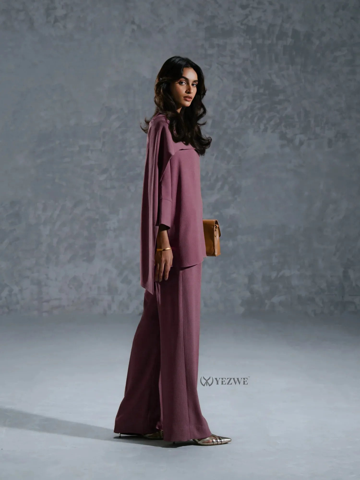 YEZWE mauve Co-Ord Set with loose top and wide-leg pants styled with a brown clutch