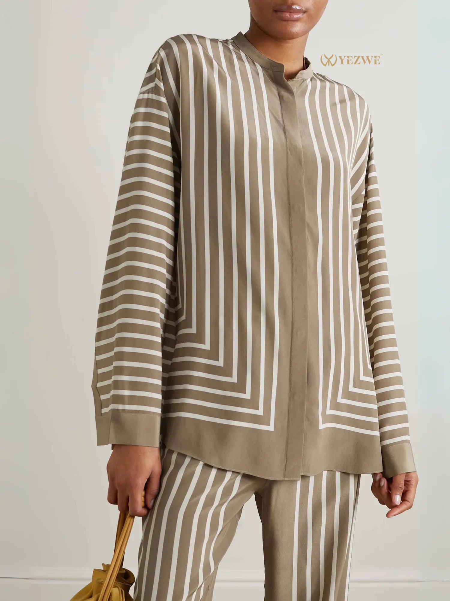 YEZWE Co-Ord Set featuring beige and white vertical striped long sleeve top and matching pants