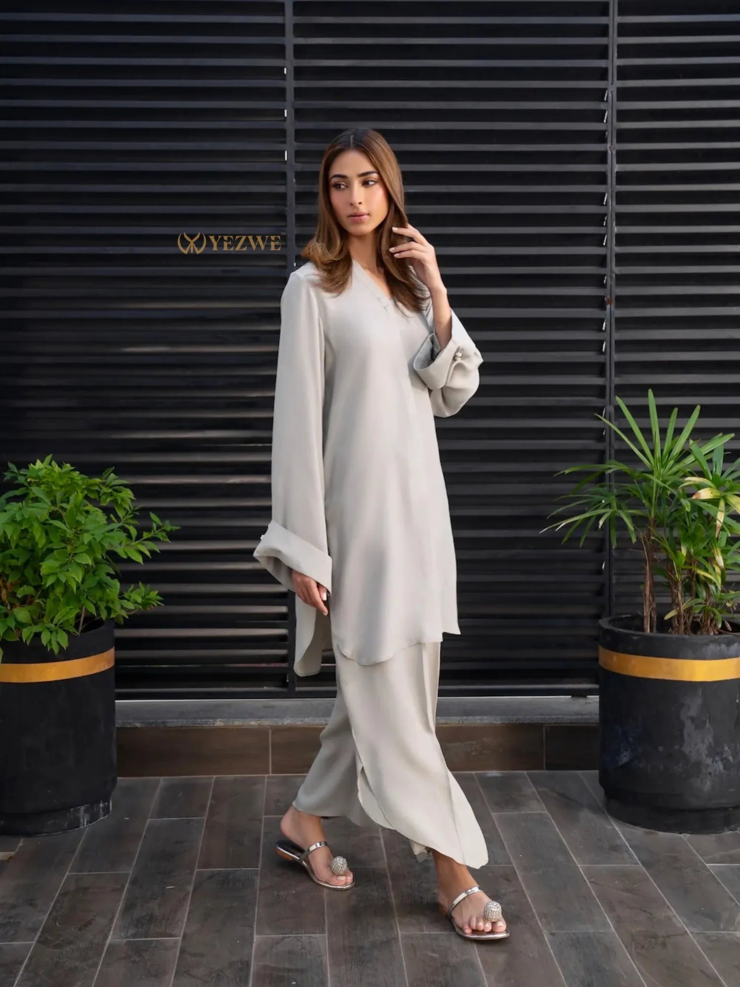 YEZWE beige Co-Ord Set with long sleeves and wide-leg pants worn by woman indoors
