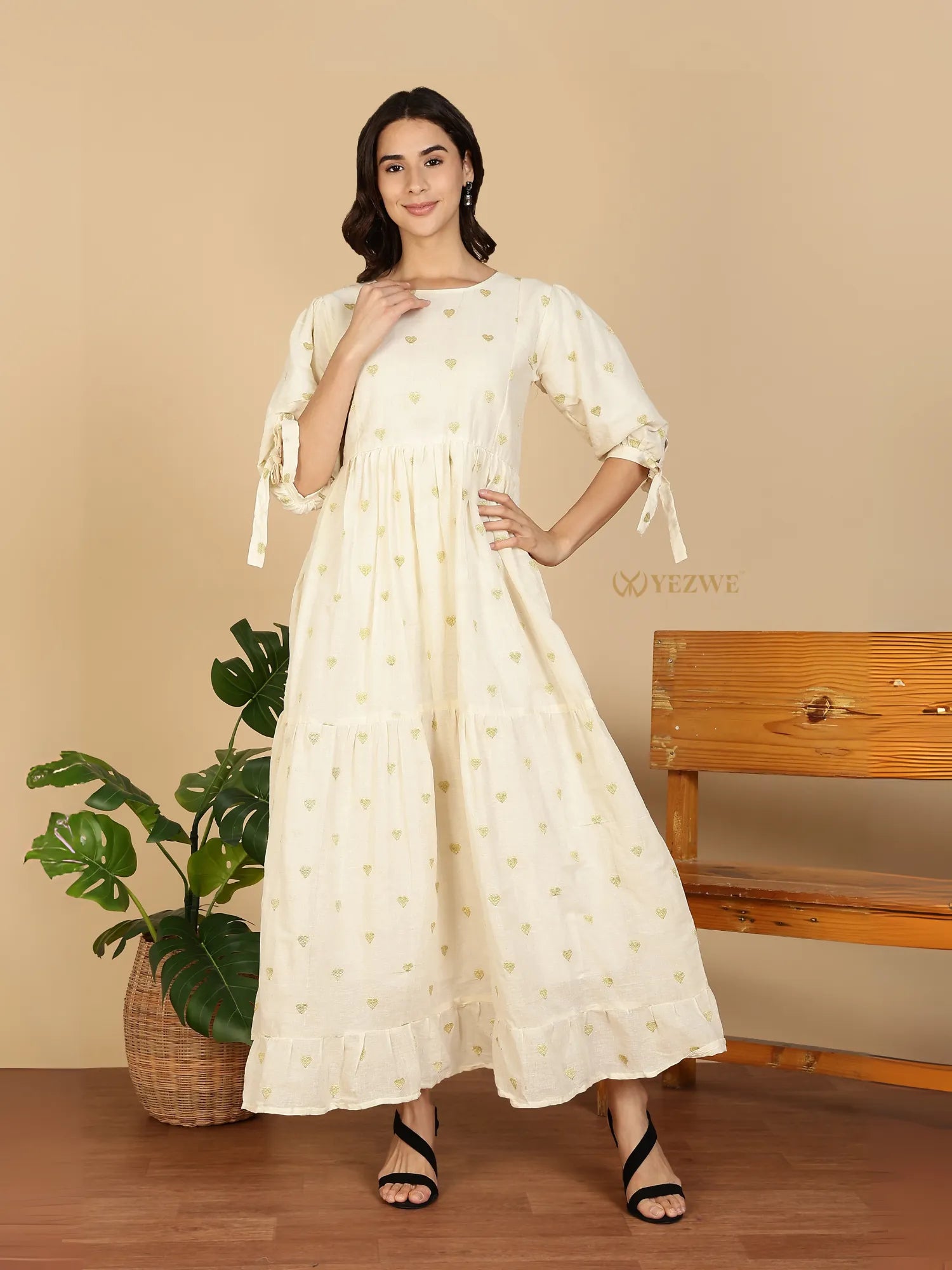 YEZWE Cotton Modest Maxi Dress cream floral tiered ruffle hem with tie sleeves on model