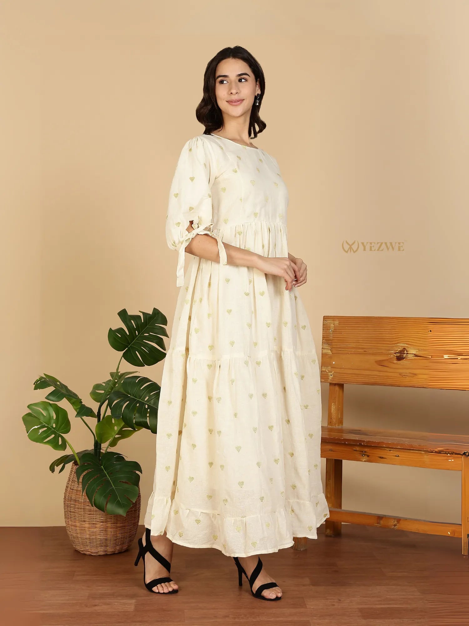 YEZWE Cotton Modest Maxi Dress in cream with green floral print, tiered ruffle hem and tied puff sleeves