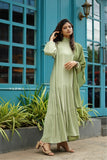 Yezwe custom modest dresses India, featuring a light green maxi dress with long sleeves and tiered design