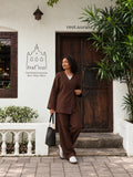 Woman wearing YEZWE Dark Brown Premium Linen Wrap Top Modest Co-Ord Set For Women while walking outside