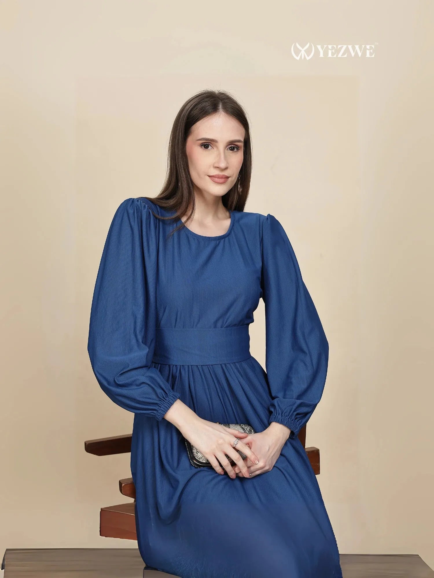 Elegant dark navy blue maxi dress by YEZWE with balloon sleeves and a fitted waist