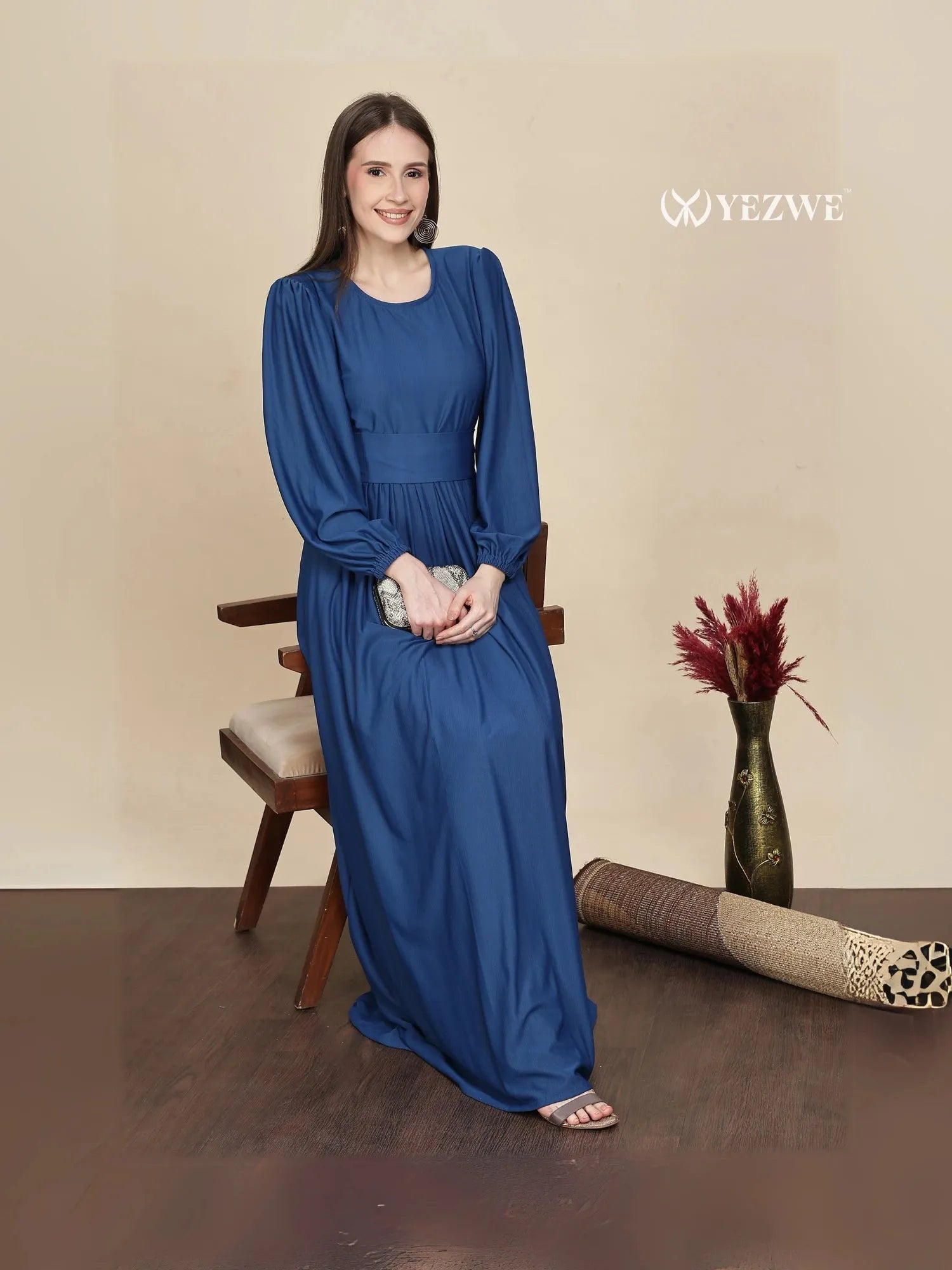 Elegant dark navy blue maxi dress by YEZWE featuring long sleeves and a flowing silhouette