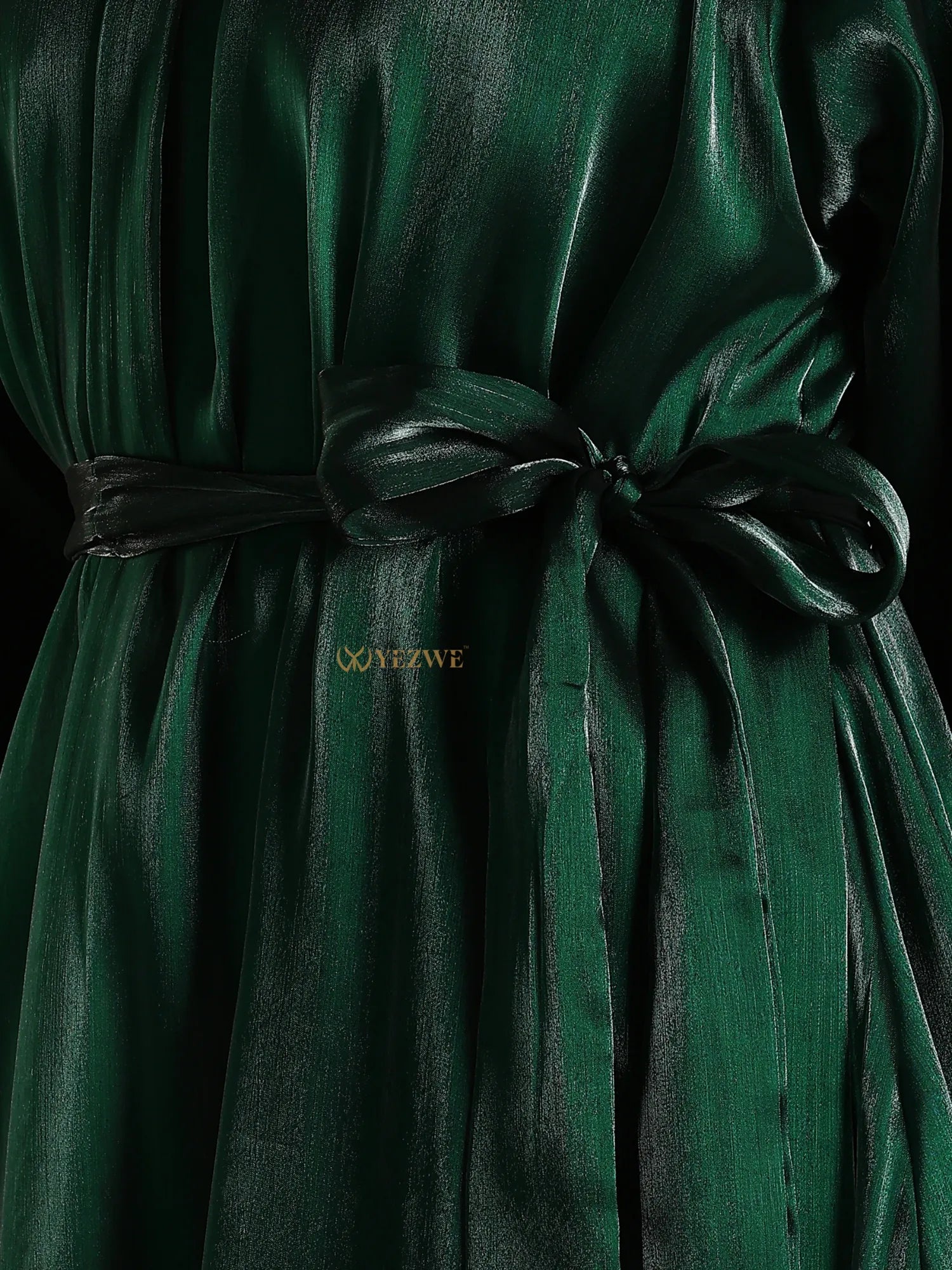 Emerald green modest maxi dress by Yezwe featuring a shiny fabric and tied waist belt