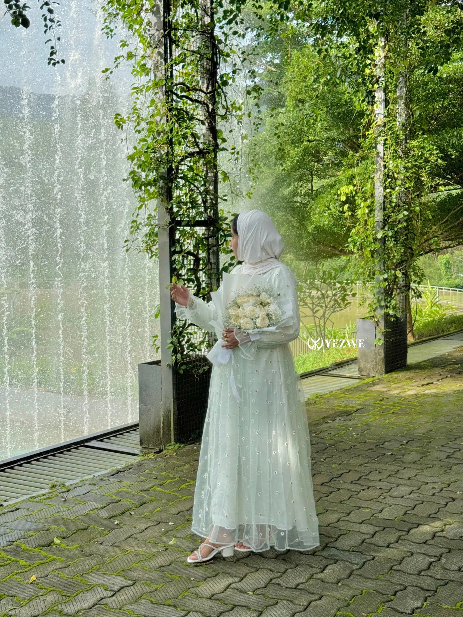 Yezwe floral embroidery gown with sheer overlay, perfect for elegant outdoor ceremonies