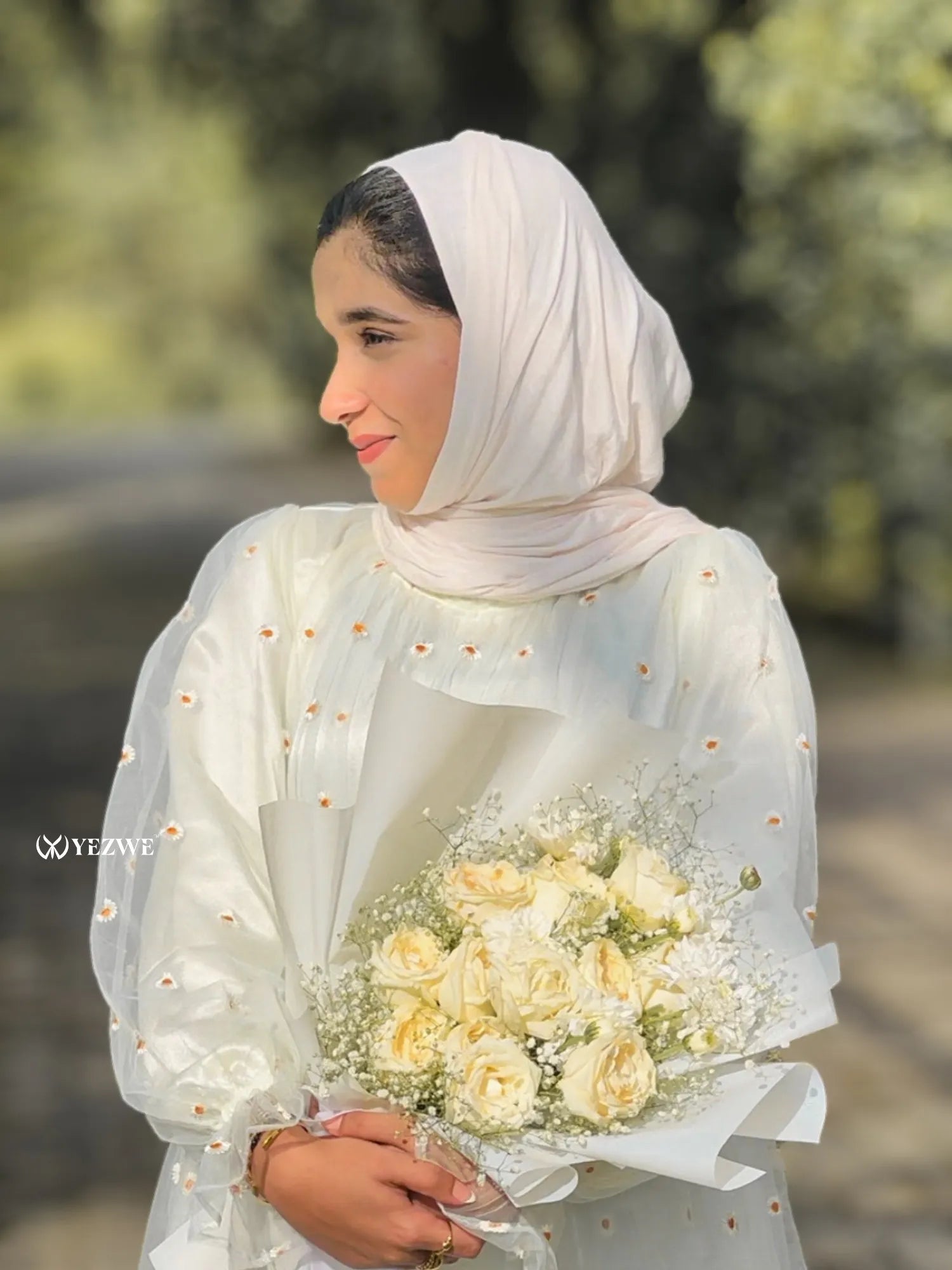 Yezwe floral embroidery gown with elegant design and flowing sleeves, perfect for special occasions