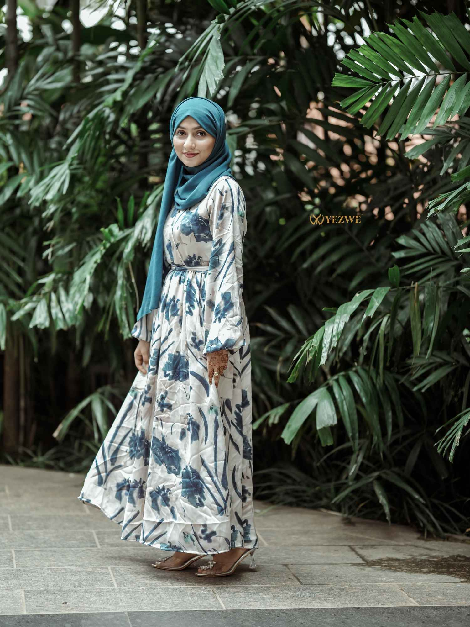 Yezwe Floral V-Neck Satin Dress in a floral print with long sleeves and a flowing silhouette