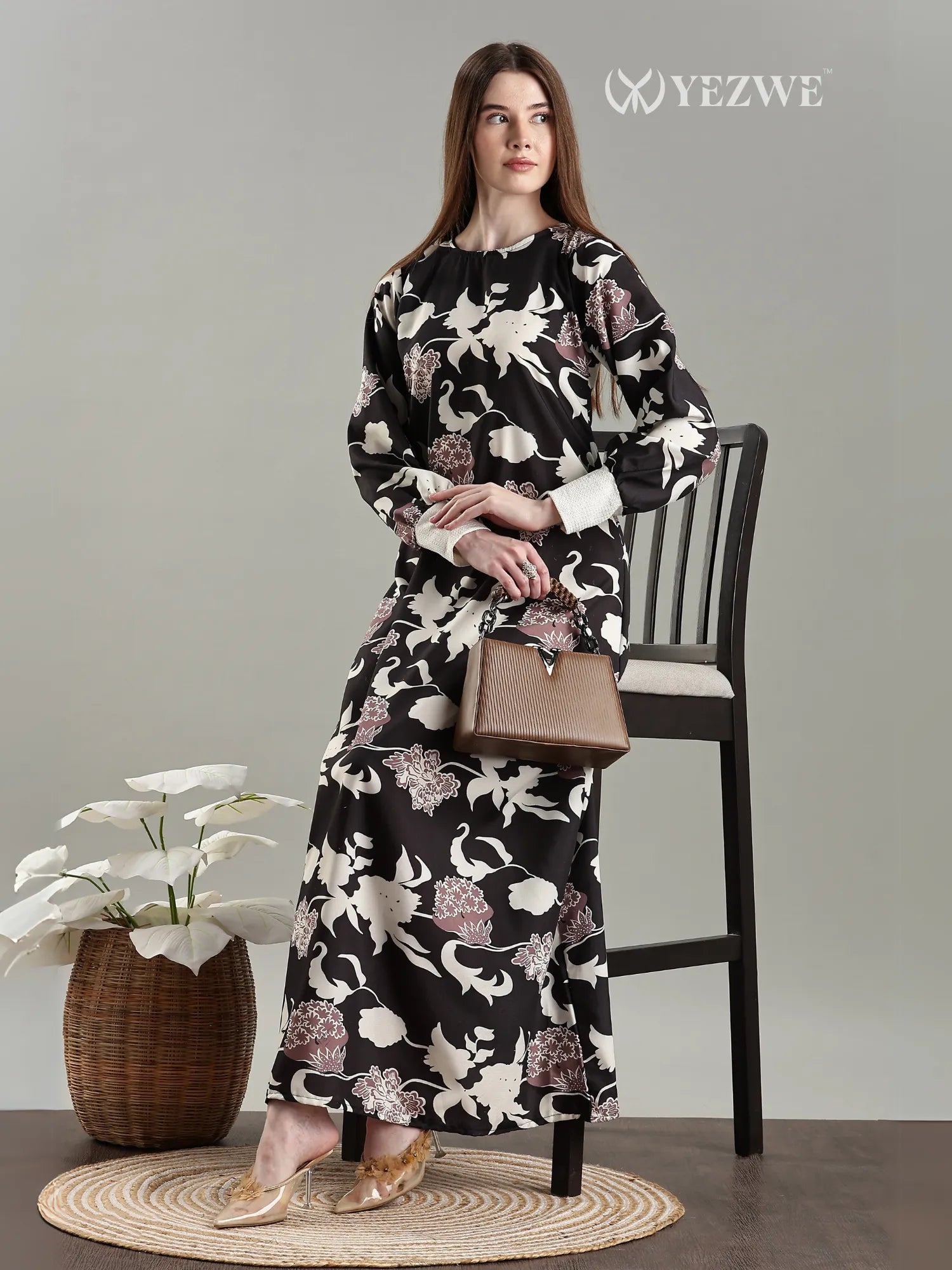 YEZWE full length floral modest maxi dresses online in elegant black and white design with a fashionable handbag