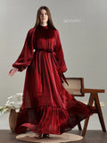 Yezwe full length jimicho Satin Flaired Maxi Dress in deep red with long puff sleeves and flowing skirt