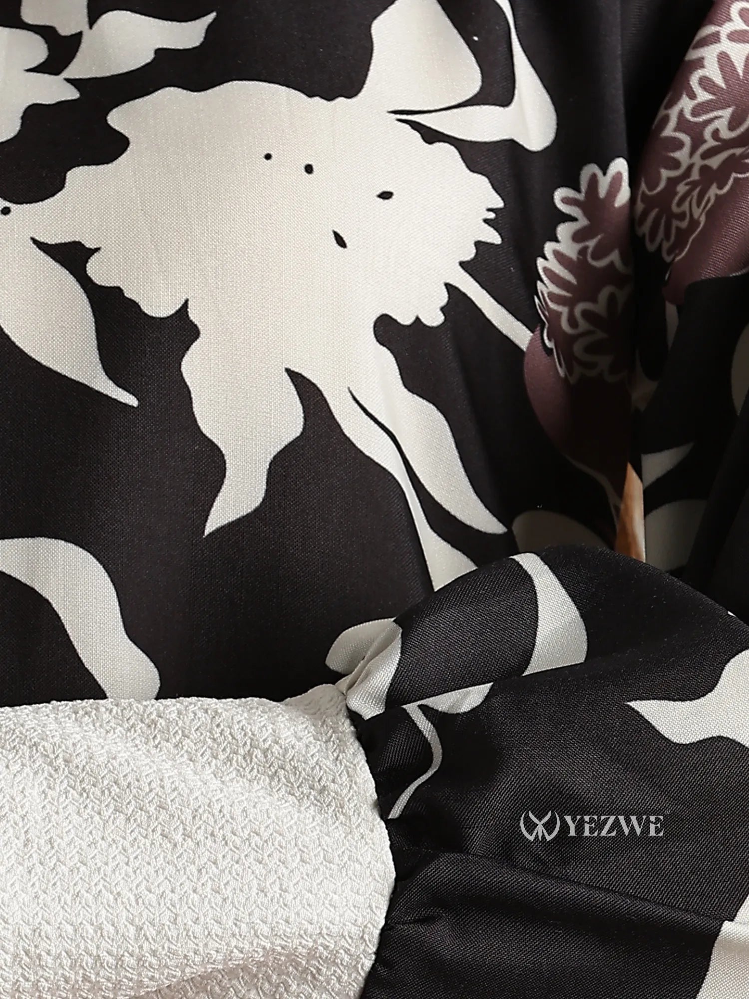 Close-up of YEZWE junior girl maxi dress fabric detail with black and white floral print featuring full-length modest dresses for girls