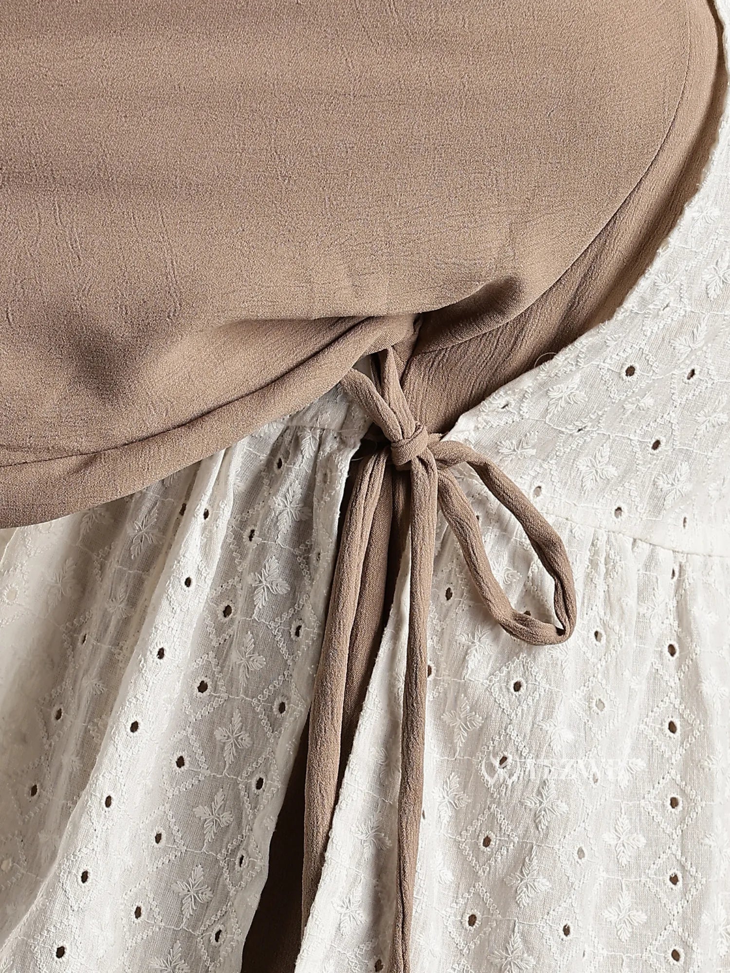 Close-up of Junior Girls Modest Maxi Dress with Hakoba Shrug showing beige tie and embroidered white fabric