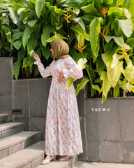 Yezwe long sleeve floral maxi dress featuring a flowy design and vibrant floral patterns on a light background