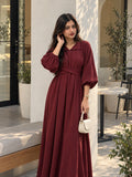 YEZWE Maroon Pleated Cross-Waist Maxi Dress for Women worn by a model in a stylish outdoor setting