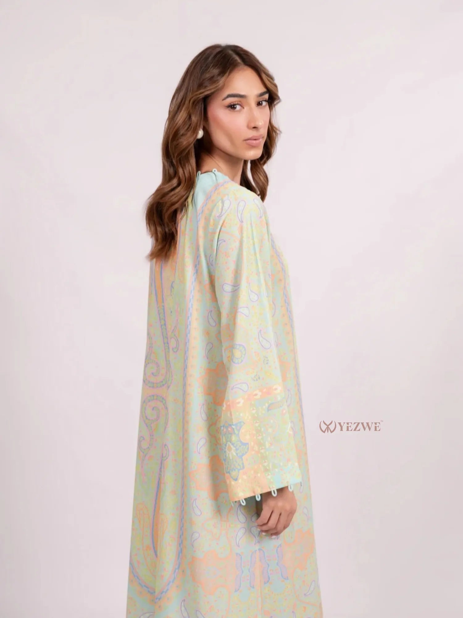 YEZWE pastel paisley Maxi Abaya Dress tunic with long sleeves and tassel cuff model side view