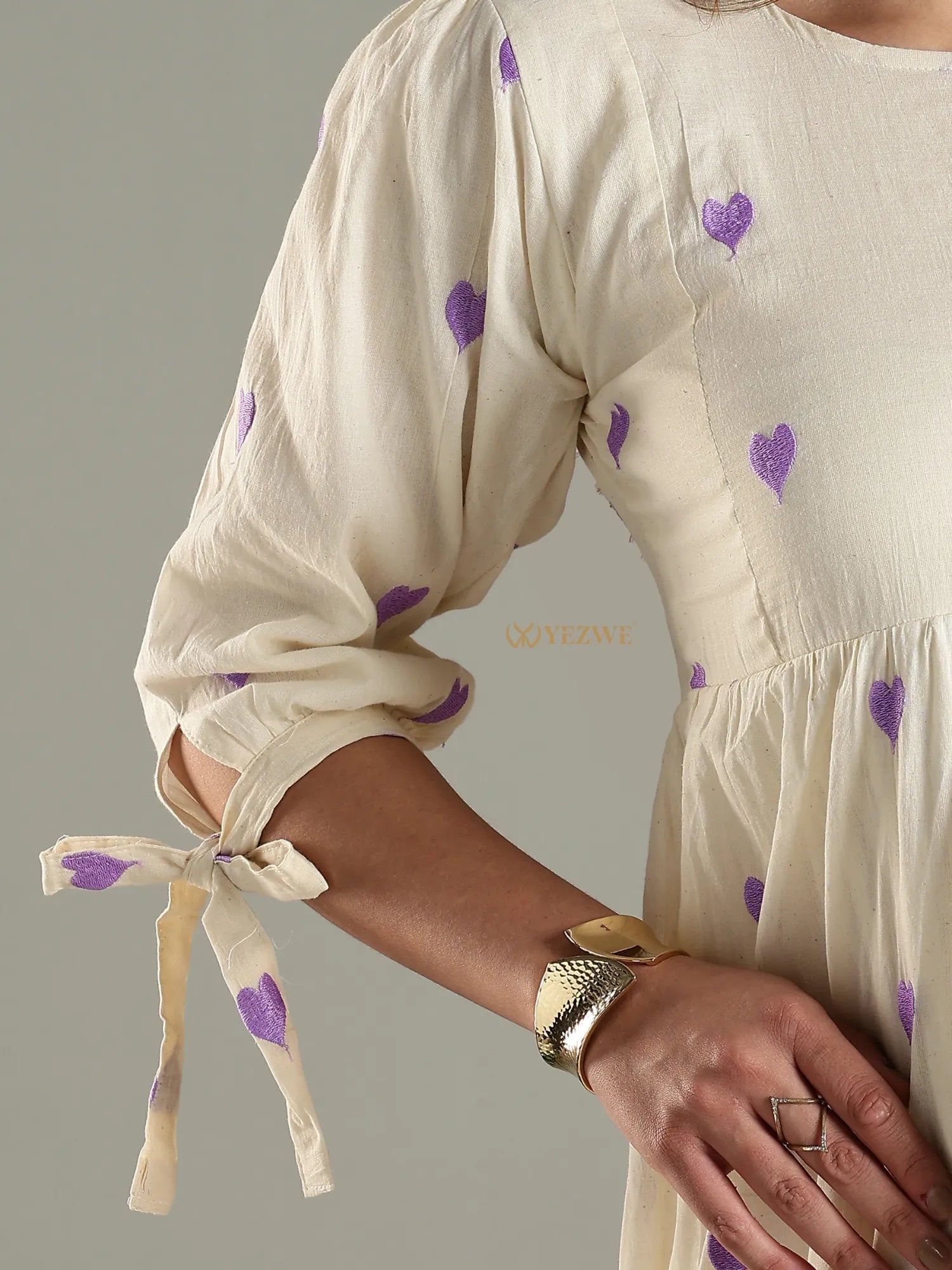 Yezwe cream maxi dress with purple heart prints and tie detail on sleeve cuff