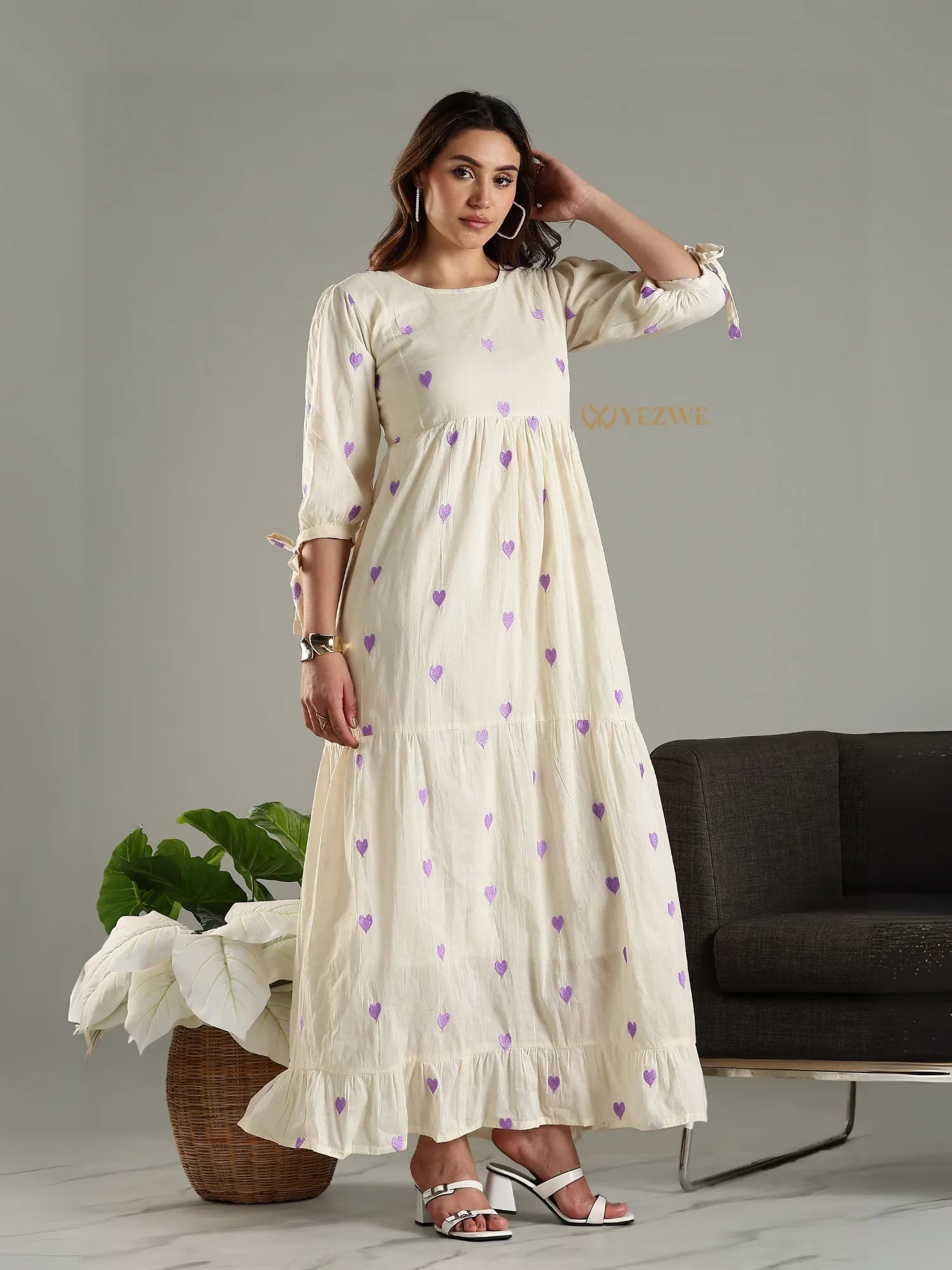 Yezwe cream maxi dress with purple heart prints and three-quarter sleeves styled with white heels