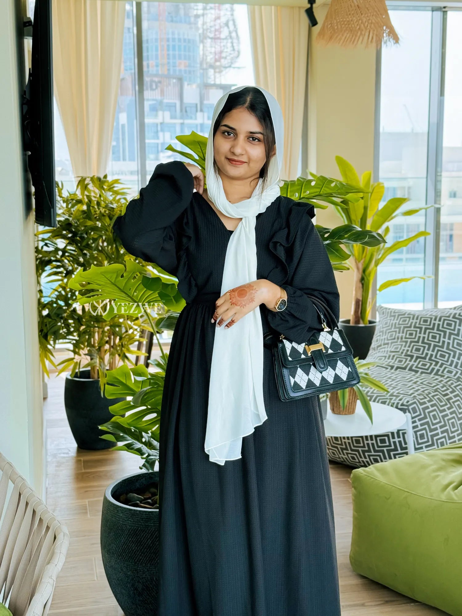 Elegant modest black maxi dress by Yezwe with ruffled sleeves and a stylish scarf