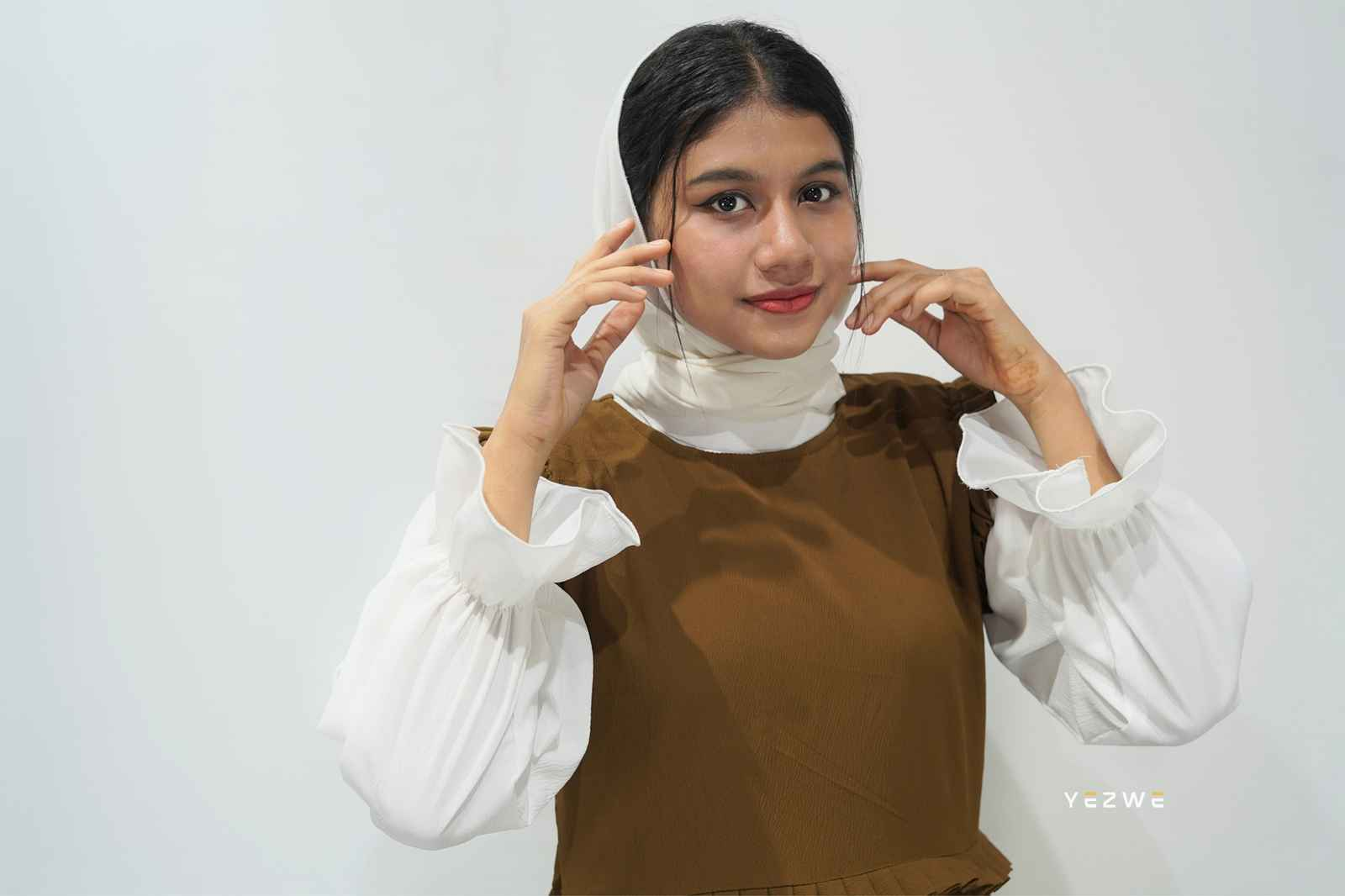 Modest brown dungaree outfit by Yezwe with a white blouse and stylish design for a chic look