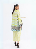Woman wearing YEZWE modest co-ord set with yellow and black patterned long top and matching pants