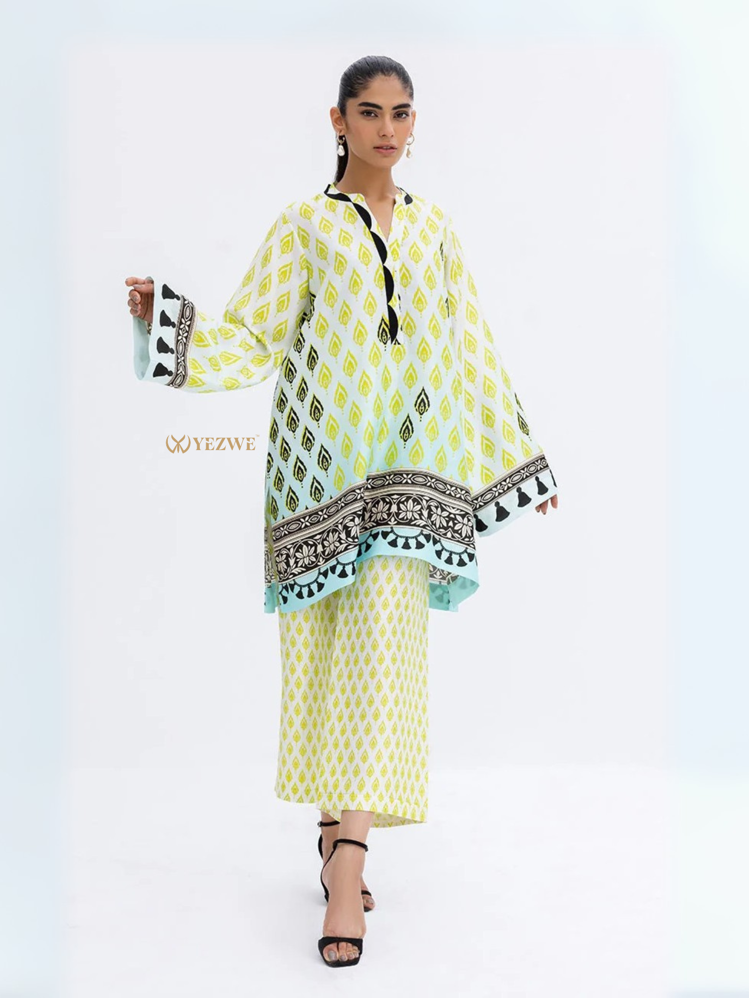 YEZWE Modest Co-ord Set featuring a long printed top with tassel details and matching skirt
