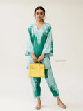 YEZWE Modest Co-Ord Set in teal with elegant patterns and flowing sleeves, paired with a yellow handbag