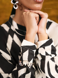 YEZWE Modest Co Ord Set black and white patterned top with unique cuff details and silver jewelry