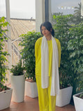 Bright yellow modest fashion co-ord set with matching pants and top, styled with a white scarf