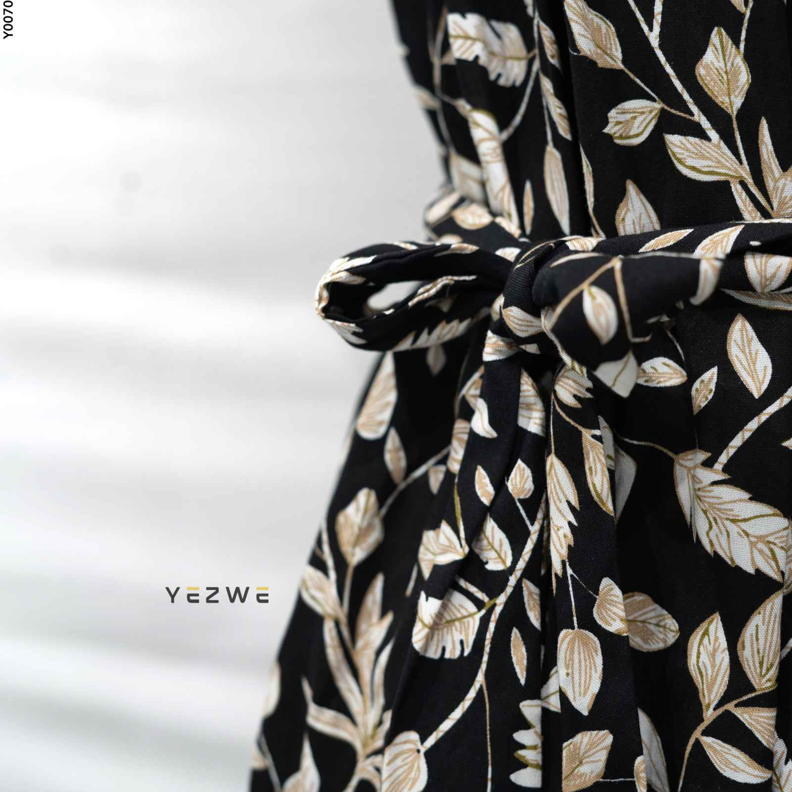 Yezwe modest floral maxi dress featuring a stylish black design with white floral patterns and a tied waist