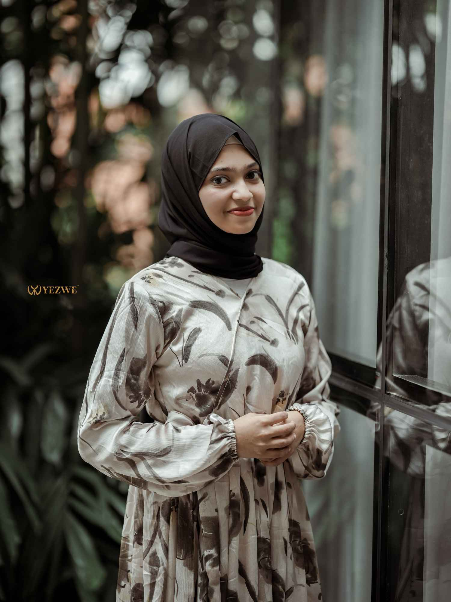 Yezwe modest floral maxi dress in soft tones with long sleeves and a flowing silhouette