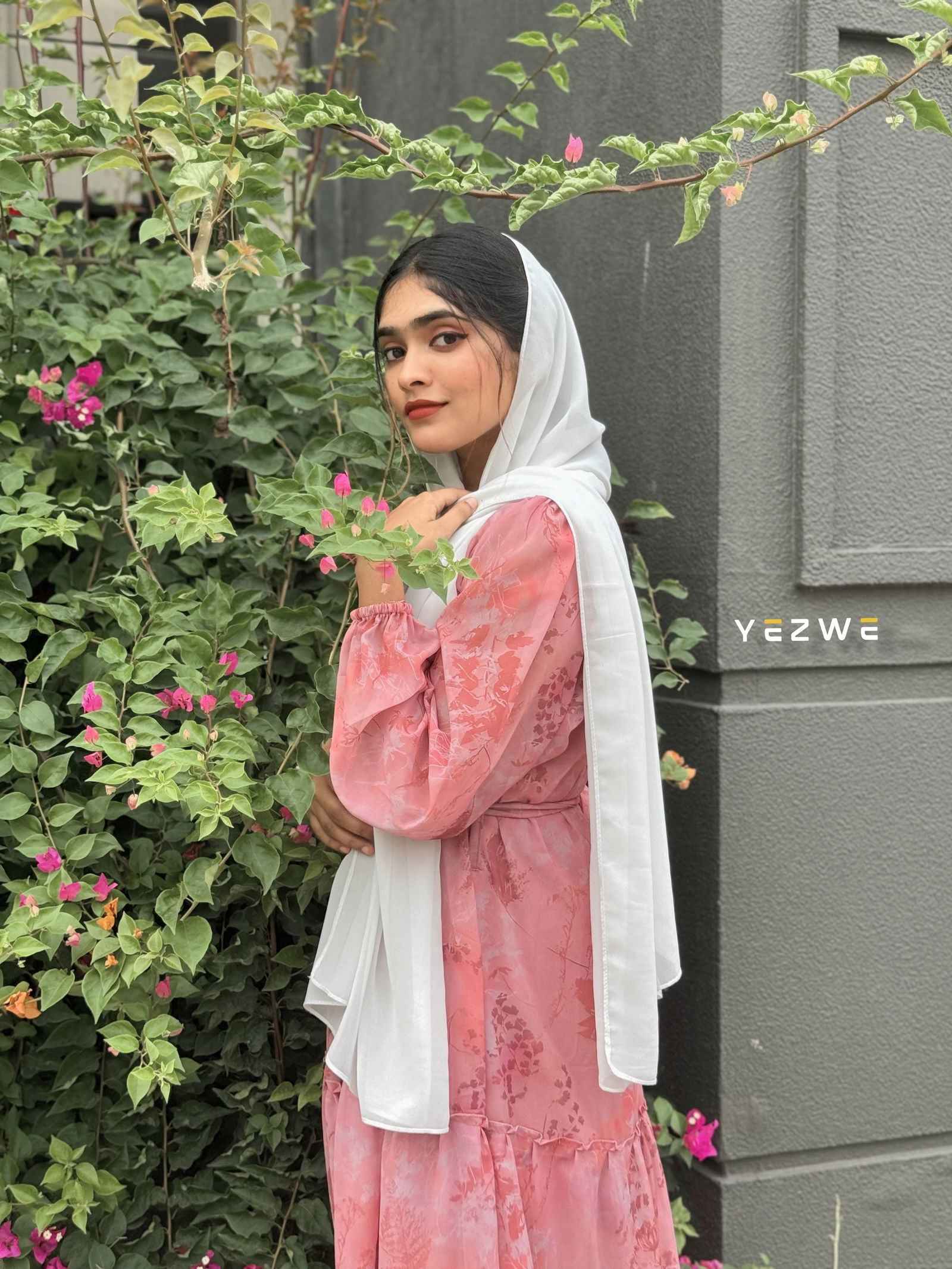 Yezwe modest georgette dress in pink with floral patterns, styled with a white scarf outdoors