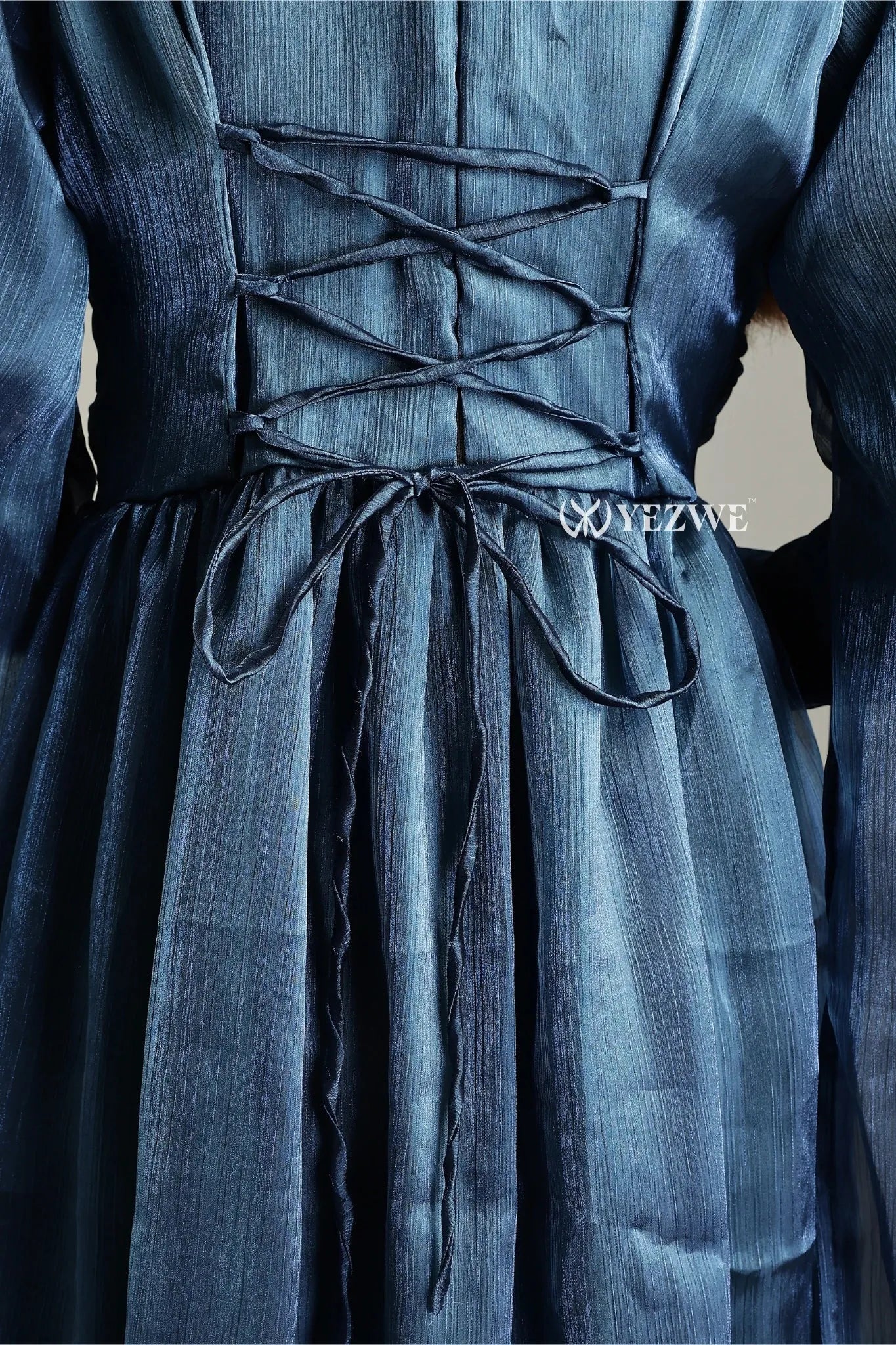 Detail of YEZWE modest in blue party maxi gown with elegant lace-up back design.