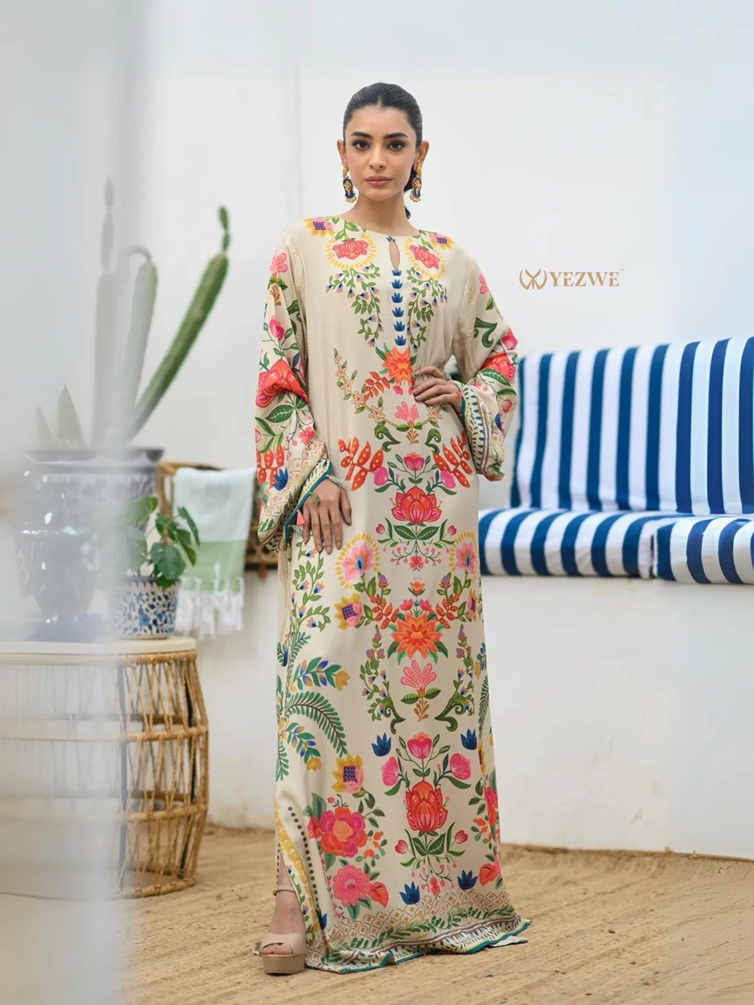 YEZWE Modest Kaftan Dress beige floral maxi dress with long sleeves and side slits worn by model