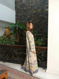 Yezwe Modest Kaftan Dress worn by model in patterned floor length tunic standing by indoor railing