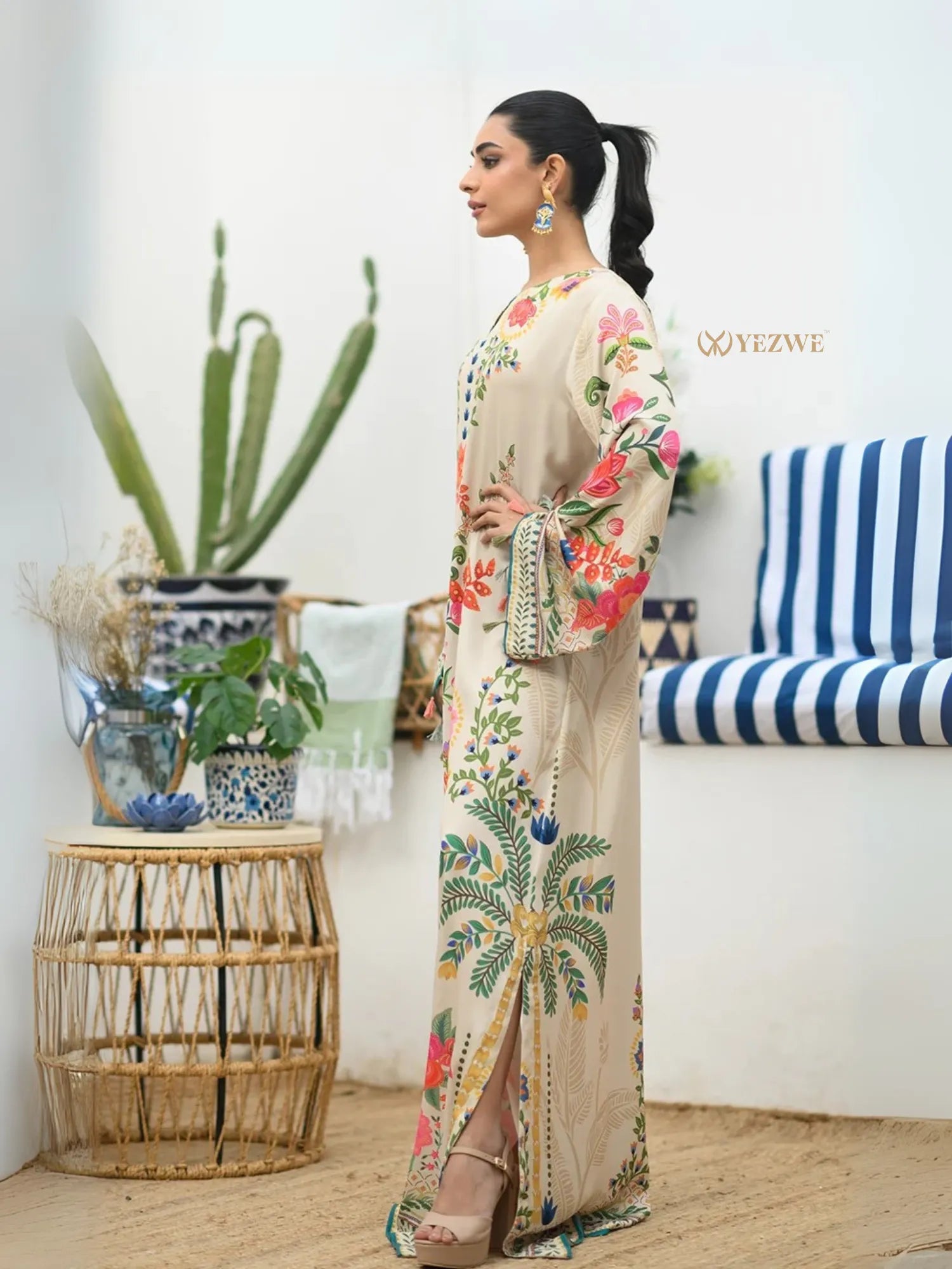YEZWE Modest Kaftan Dress beige floral embroidered maxi with long sleeves and side slit on model